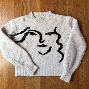 Paloma Wool “Anita” cream sweater with abstract face design